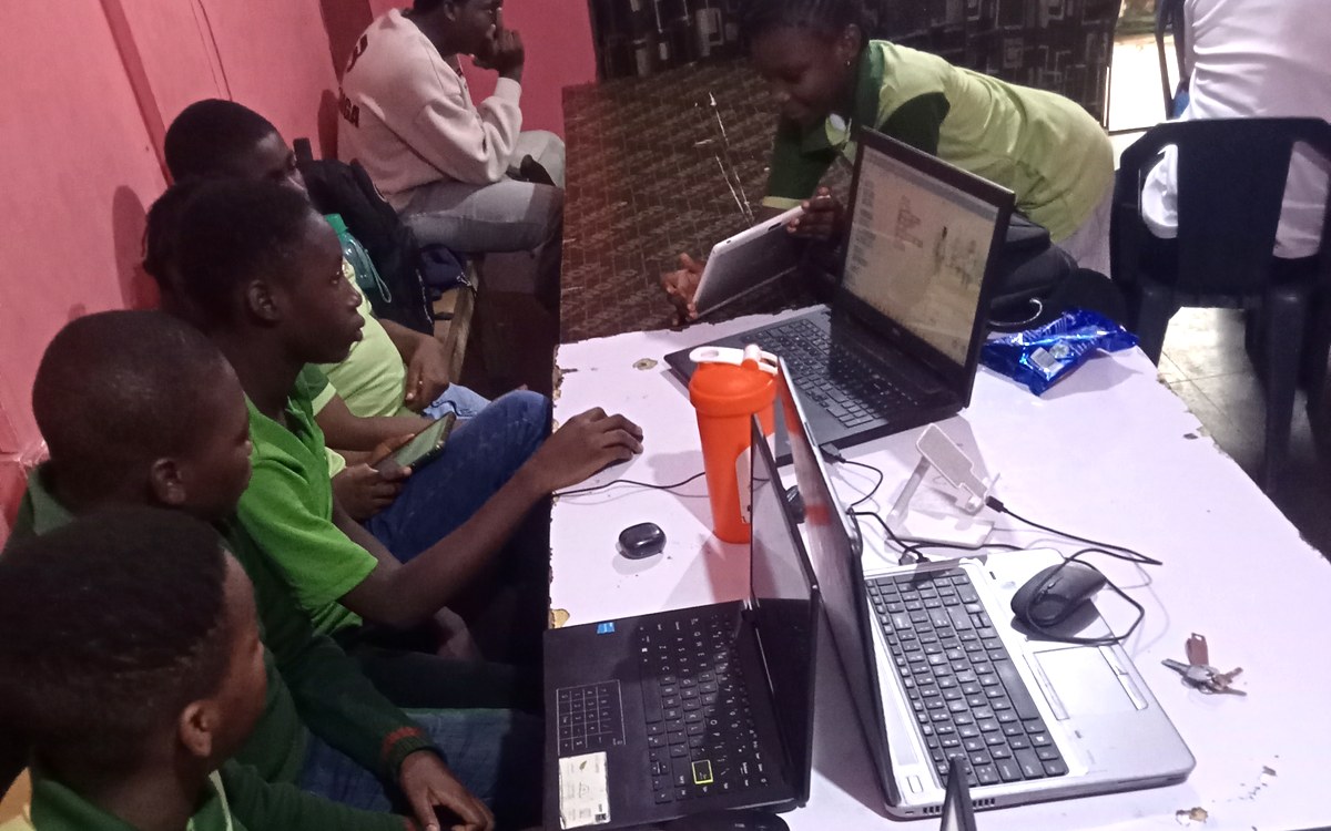Students working on laptops during a Harmonics Hub ICT and coding class
